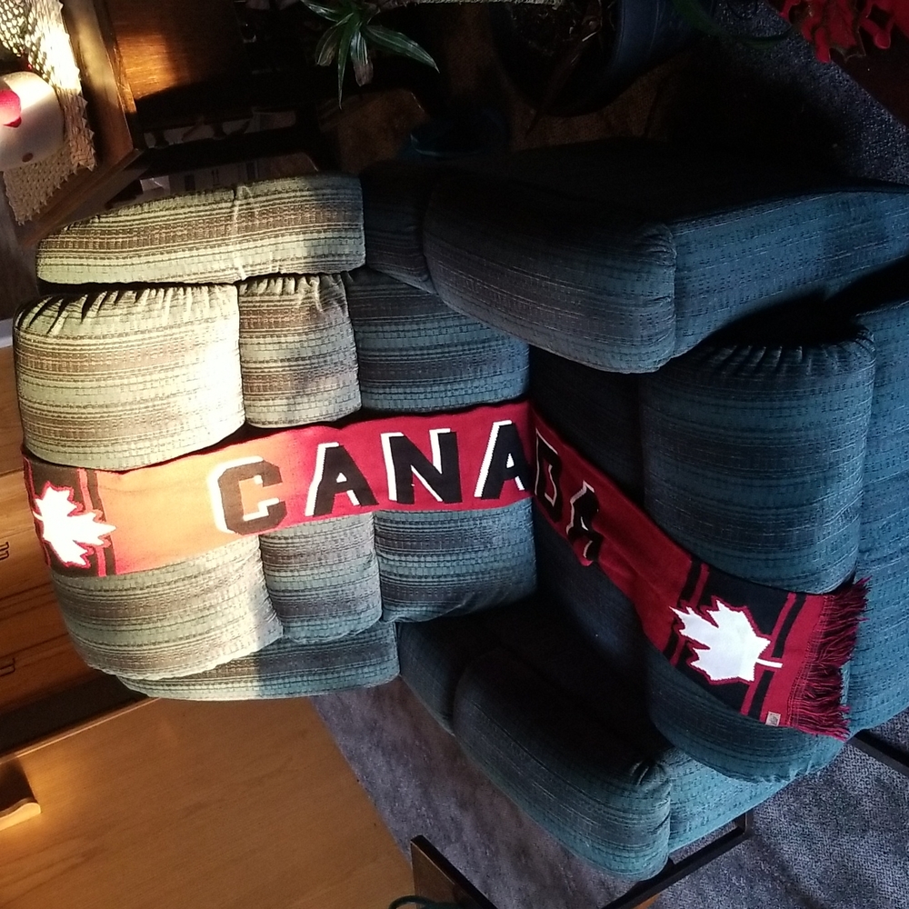 Canada scarf 60 inches long 7 inches wide. Like new